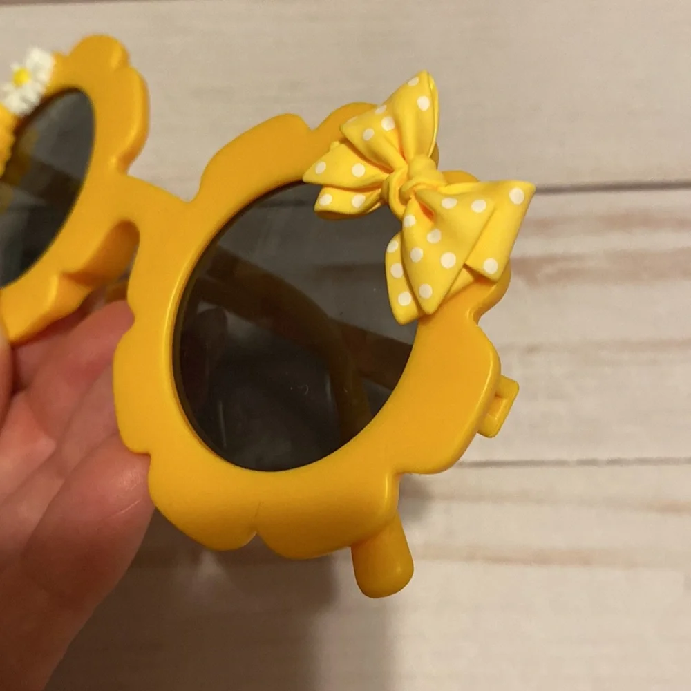 Girls yellow flower shaped sunglasses